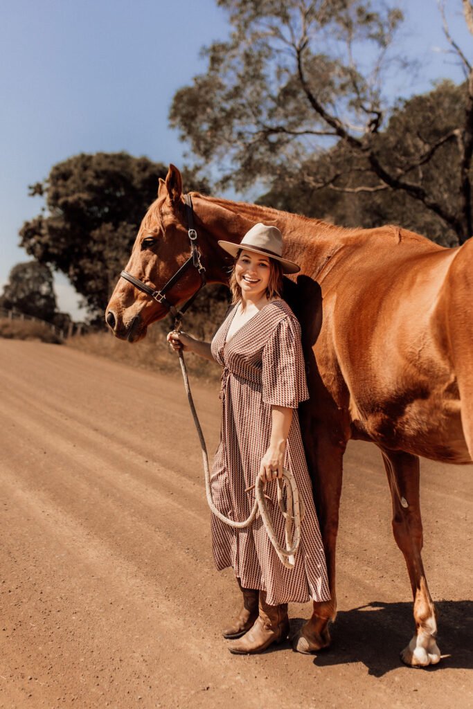 Brittany, CEO of Stable and Grounded, with her horse.
