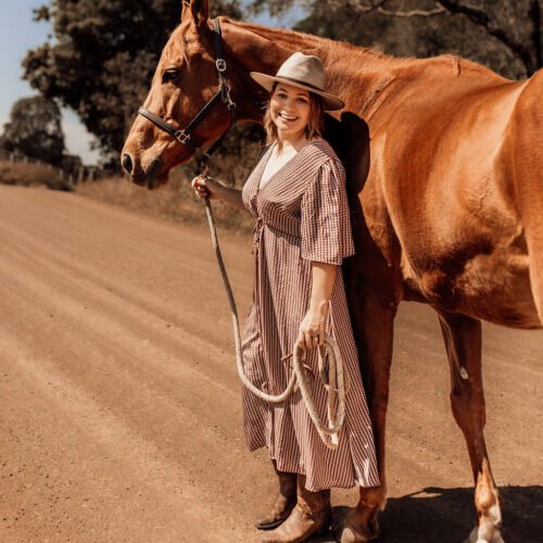 Brittany, CEO of Stable and Grounded, with her horse.